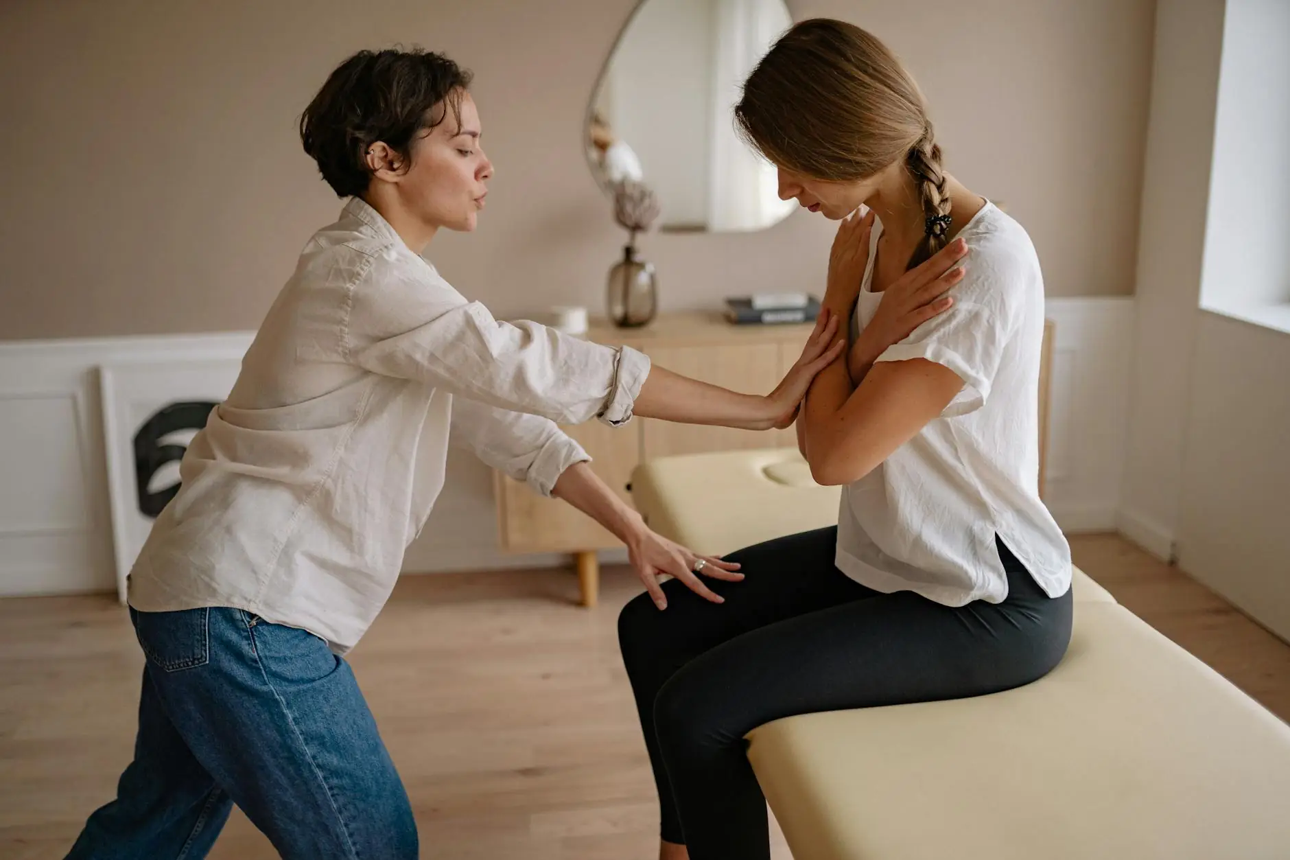 Patient in a chiropractic consultation for ongoing spinal wellness care